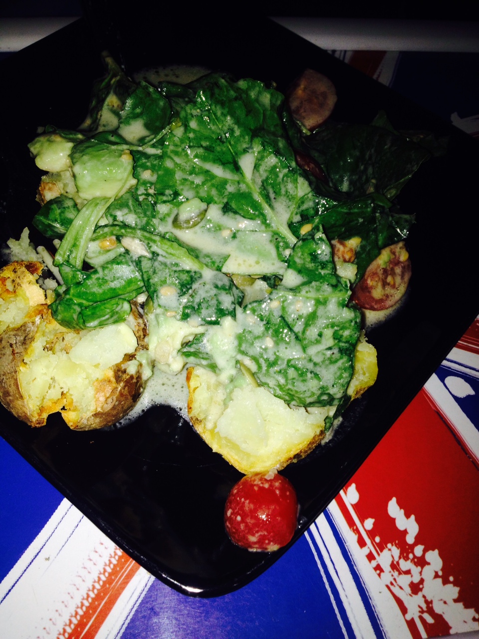 Baked Potato topped with Kale Salad & Tahini Lemon Dressing