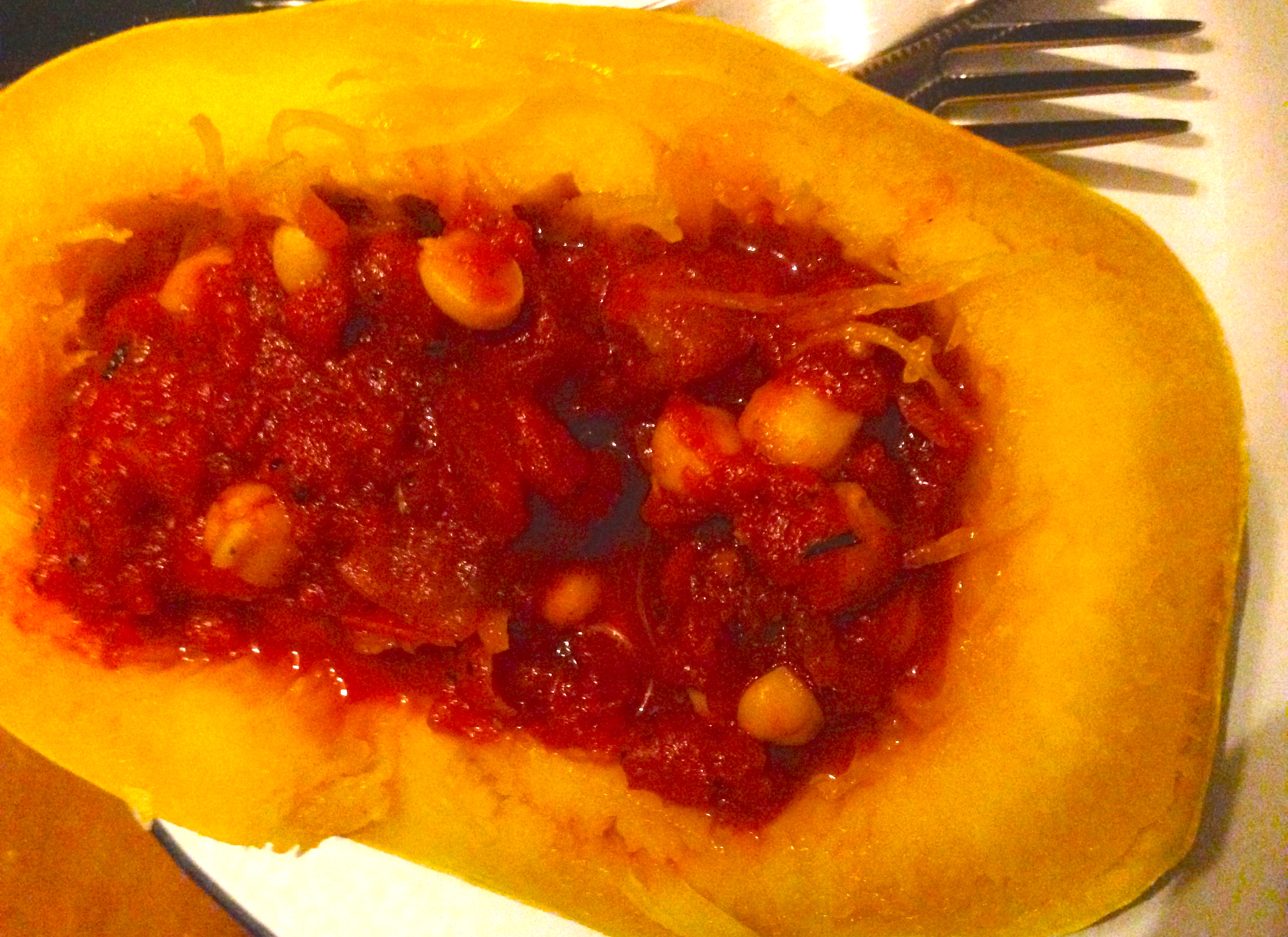 Roasted spaghetti squash with tomato chick pea stuffing
